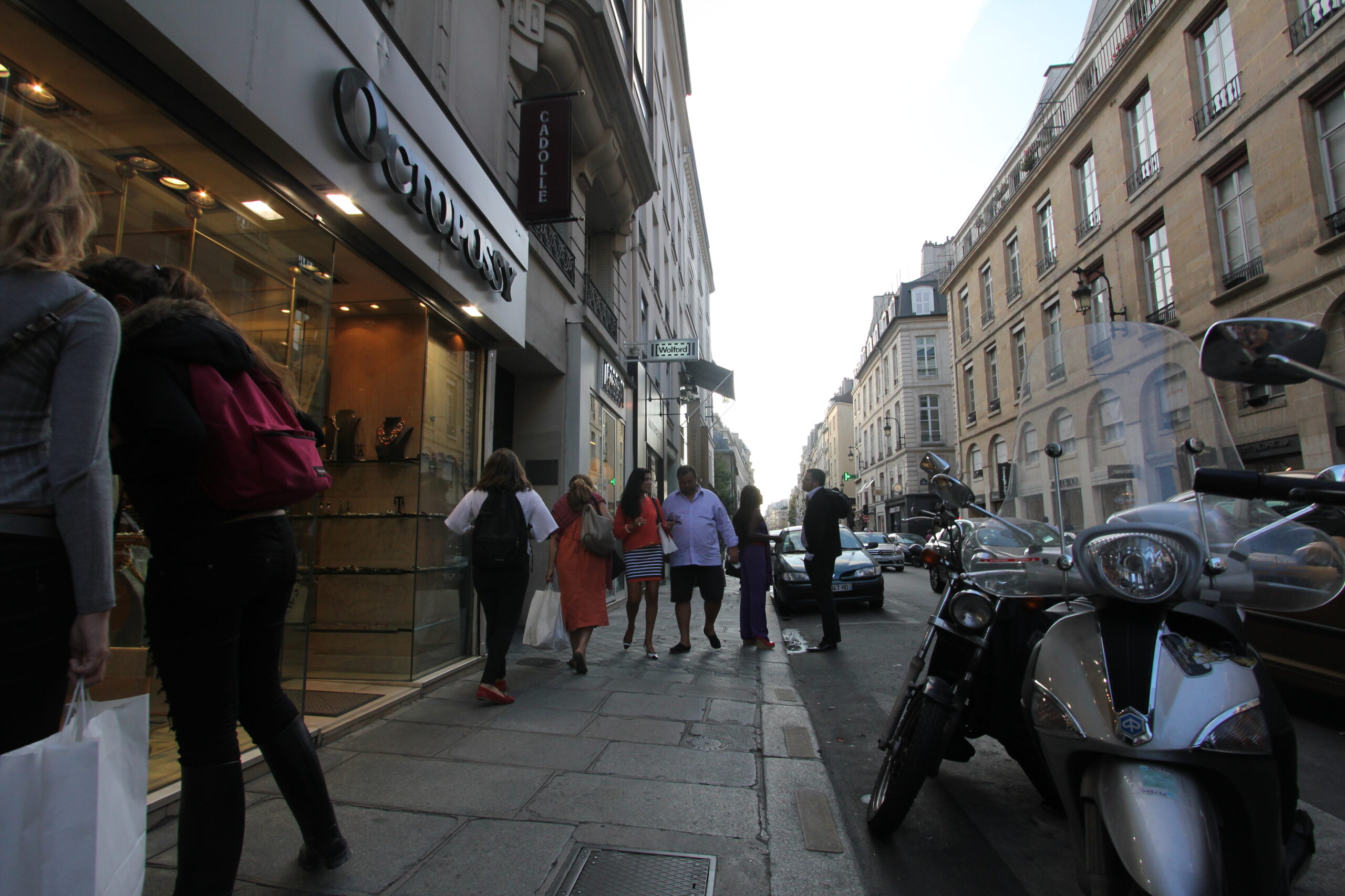 The before shot is a wide-angle frame on rue Saint-Honoré in Paris